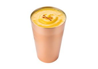 A vibrant, golden-yellow beverage, presented in a copper-toned metal tumbler, with a sprinkle of saffron strands.