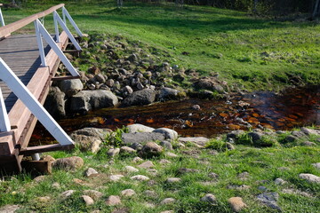 wooden bridge over a narrow river