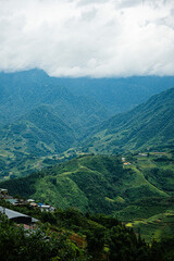 Fototapeta premium Misty mountains and valley view in Sapa, Vietnam