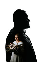 Creative double exposure of a groom’s silhouette with a bride holding a bouquet inside,...