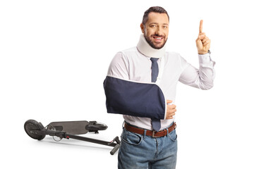 Electric scooter accident and injured man with a cervical collar and arm sling pointing up