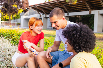 Students sharing funny content on smartphones in university campus