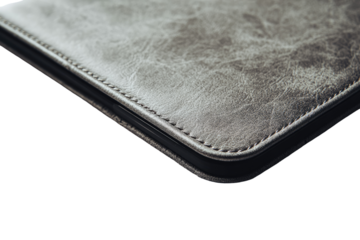 Close-up of a light gray leather-like tablet case, showing a corner and stitching
