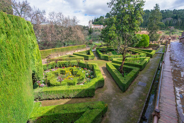 A view of the extensive gardens and architectural elements at the historic Alhambra Palace in...