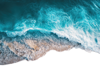 Aerial view of foamy waves crashing on a sandy shore