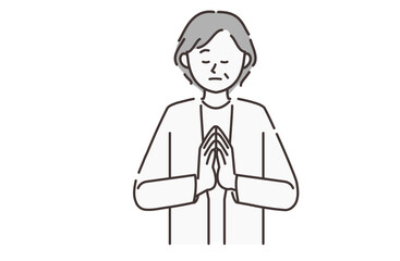 合掌する年配の女性