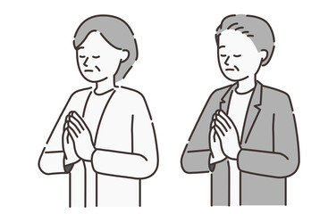 合掌する年配の男性と女性