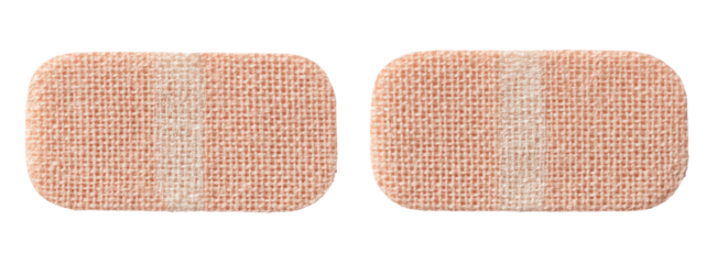 Two light beige rectangular adhesive bandages