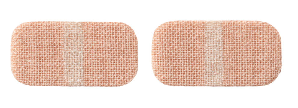 Two light beige rectangular adhesive bandages
