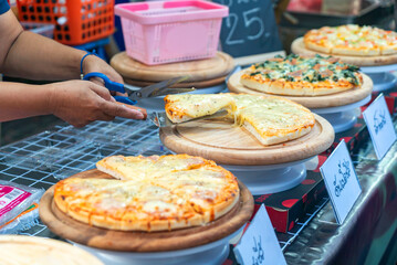 Delicious Pizza Being Served at Food Market