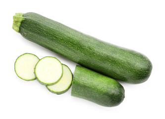 Whole and cut fresh zucchinis isolated on white, top view
