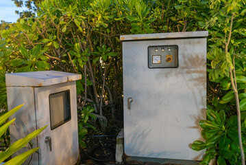 Utility Boxes Hidden in Greenery Landscape