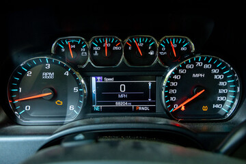 truck dashboard with warning lights, check engine and low tire warning lights