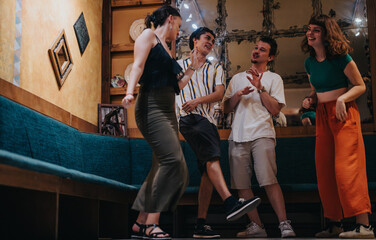 A joyful group of young friends laughing and dancing in a cozy bar setting, creating lasting...