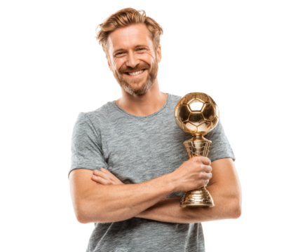 Man celebrates victory, holding a golden trophy.