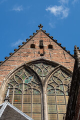 Amsterdam Old Church (Oude Kerk), oldest parish church, founded in 1213. Oude Kerk stands in Amsterdam De Wallen district on Old Church's Square (Oudekerksplein). Amsterdam, The Netherlands.