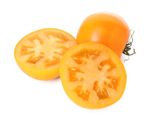 Whole and cut yellow tomatoes isolated on white