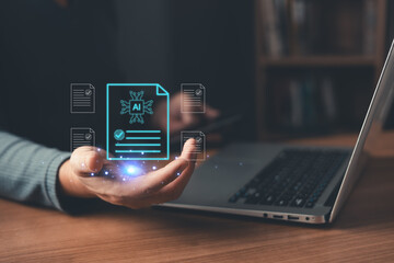 person holds glowing AI-powered digital documents while using a laptop, symbolizing artificial intelligence, automation, data processing, smart approval, and innovation in digital document management.