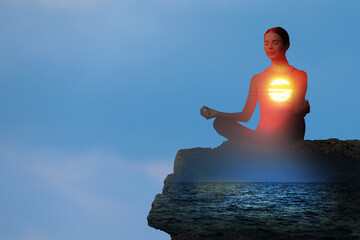 Practicing yoga in nature. Woman meditating in lotus position on cliff. Double exposure with...