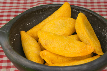 Delicious traditional Colombian empanadas with spicy sauce