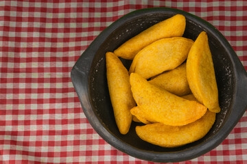 Colombian empanada with spicy sauce 