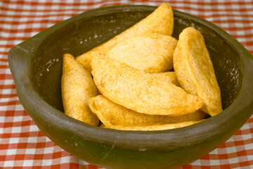 Colombian empanada with spicy sauce 