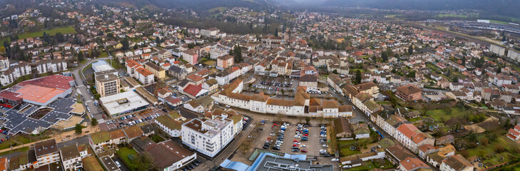 An aerial panorama view around the old town in the city Ambérieu-en-Bugey in France on a cloudy morning in early spring