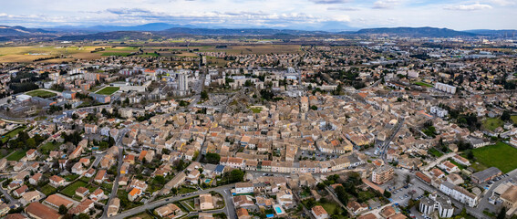 An aerial panorama view around the old town in the city Pierrelatte   in France on a sunny morning in early spring