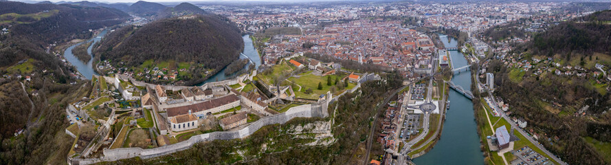 Aerial view of the old town of the city Besancon in France on a cloudy afternoon in early spring.