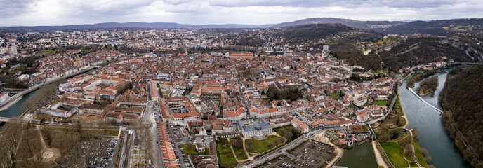 Aerial view of the old town of the city Besancon in France on a cloudy afternoon in early spring.