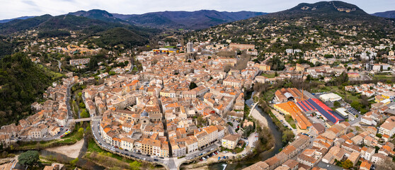 An aerial panorama view around the old town in the city  Lodève in France on a sunny morning in early spring