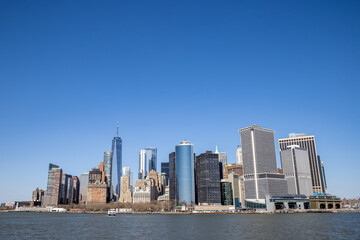 Naklejka premium USA, New York, New York City, Lower Manhattan, View of Buildings at South tip of Manhattan