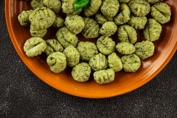 Gnocchi spinach potato dough second course portion size natural product tasty snack fresh delicious gourmet food background on the table rustic top view copy space