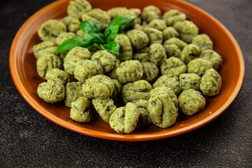 Gnocchi spinach potato dough second course portion size natural product tasty snack fresh delicious gourmet food background on the table rustic top view copy space