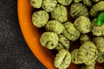 Gnocchi spinach potato dough second course portion size natural product tasty snack fresh delicious gourmet food background on the table rustic top view copy space