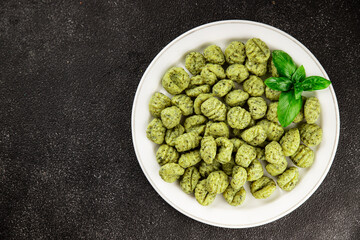 Gnocchi spinach potato dough second course portion size natural product tasty snack fresh delicious gourmet food background on the table rustic top view copy space