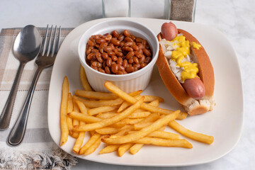 hot dog with  baked beans and fries