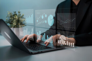 Light blue overlay displays data visuals as hands type on laptop. Shows charts, graphs, and key data, great for corporate presentations, financial projects.