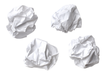 Crumpled white paper balls.  Four distinct crumpled paper balls,  isolated on a black background