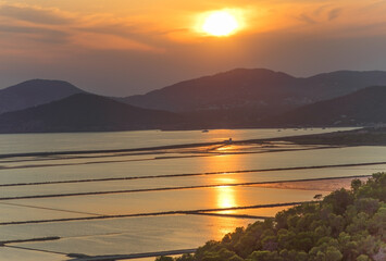 Sunset over Parc Natural de ses Salines salt flats in Ibiza