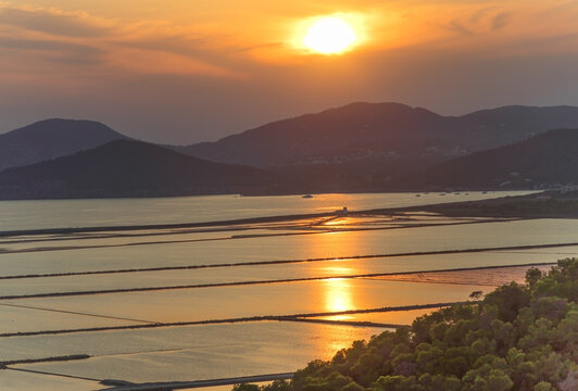 Sunset over Parc Natural de ses Salines salt flats in Ibiza