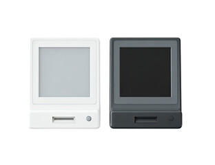 Two small, square devices, one white and one dark gray, featuring a simple LCD screen.  Each has a slot, likely for a card or memory.  A small circular sensor is visible on each unit