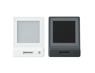 Two small, square devices, one white and one dark gray, featuring a simple LCD screen.  Each has a slot, likely for a card or memory.  A small circular sensor is visible on each unit