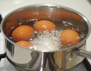 Eggs simmering in a saucepan