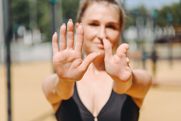 young slim athletic caucasian woman portrait, close up view of hands, hand and fingers defect from...