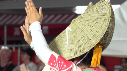 TOKYO, JAPAN - AUG 2025 : Awa Odori dance festival in Koenji. Powerful and energetic dance and music. Traditional Japanese summer event in Tokyo. Slow motion shot of dancer.