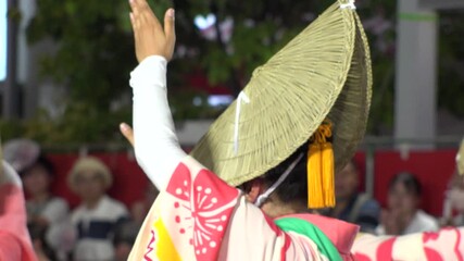 TOKYO, JAPAN - AUG 2025 : Awa Odori dance festival in Koenji. Powerful and energetic dance and music. Traditional Japanese summer event in Tokyo. Slow motion shot of dancer.