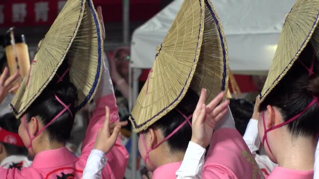 TOKYO, JAPAN - AUG 2025 : Awa Odori dance festival in Koenji. Powerful and energetic dance and music. Traditional Japanese summer event in Tokyo. Slow motion shot of dancer.