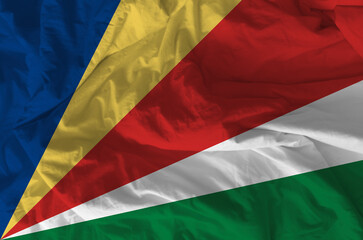 Stylized image of Seychelles flag with crumpled paper texture and halftone effect. Concept of...