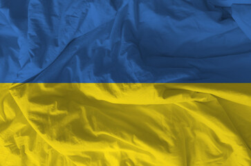 Stylized image of Ukrainian flag with crumpled paper texture and halftone effect. Concept of...
